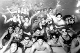 Swimmers pose for underwater image, St. Cloud State University