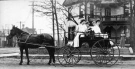 Women students ride in a buggy, St. Cloud State University