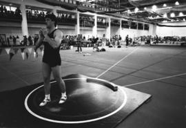 An athlete throws a shot put, St. Cloud State University