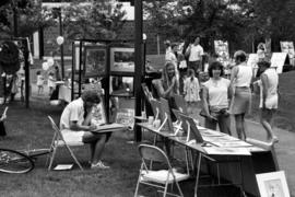 People walk past art vendors, Lemonade Concert and Art Fair, St. Cloud State University