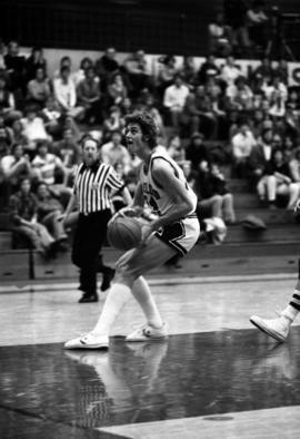 St. Cloud State University basketball player Dan Hagen gets ready to jump with the basketball during a game against Bemidji State University