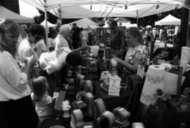 People shop at a vendor's booth, Lemonade Concert and Art Fair, St. Cloud State University