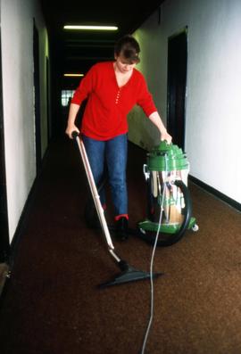 St. Cloud State student vacuums a corridor, Aalborg, Denmark