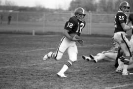 St. Cloud State football player Keith Nord runs with the football in a game against Southwest State University