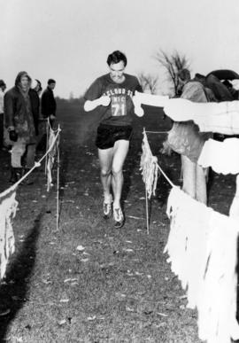 A runner finishes a race, St. Cloud State University