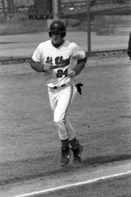 Mike McKinney runs down a baseline during a baseball game, St. Cloud State University