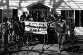 Theta Chi men prepare for the Mississippi crossing swim parade, St. Cloud State University