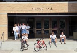 People gather on the steps on Stewart Hall (1948) during the Lemonade Concert and Art Fair, St. Cloud State University