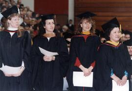 Jessica Finch Ostman and three other women at commencement, St. Cloud State University