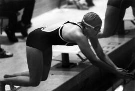 A St. Cloud State University woman swimmer at a meet against South Dakota University
