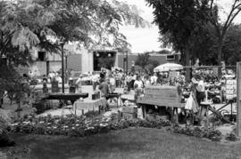 People walk past art vendors, Lemonade Concert and Art Fair, St. Cloud State University