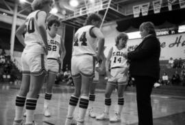 Basketball coach Gladys Ziemer talks to her players, St. Cloud State University