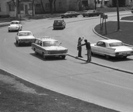 Protestors pass leaflets to passing cars, Day of Peace protest, St. Cloud State University