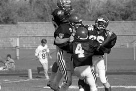 Preston Harmon and his teammates celebrate his winning touchdown against Mankato State University, St. Cloud State University