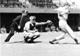 "The camera catches the perfect form of Norb Kalthoff hitting, the catcher's outstretched hand, and the ump," St. Cloud State University