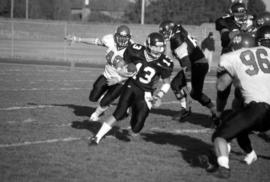 St. Cloud State University quarterback Keith Heckendorf runs with a football