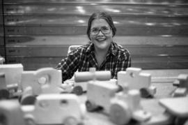 Woman sells merchandise, Lemonade Fair, St. Cloud State University