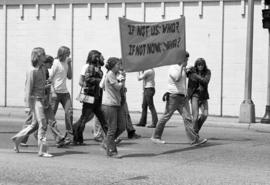 Protestors march on the street, Day of Peace protest, St. Cloud State University