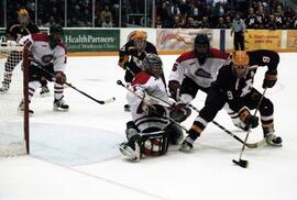 Action during a hockey game against the University of Minnesota, St. Cloud State University