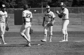 Players gather during a St. Cloud State University baseball game against Augsburg College