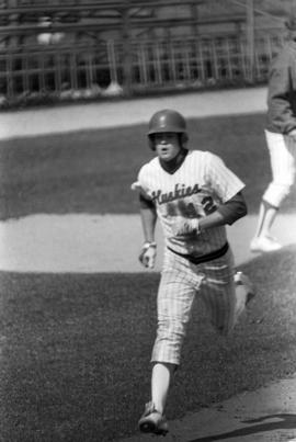 Greg Berling rounds third base during a baseball game, St. Cloud State University