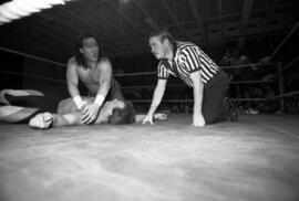 Wrestler Pat Tanaka pins Ricky Rice during a match at the Sauk Rapids High School