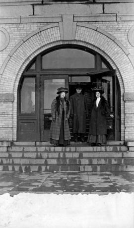 Students gather at an entrance of Old Main building (1874), St. Cloud State University