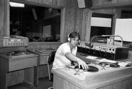 A man broadcasts at KVSC studios, St. Cloud State University