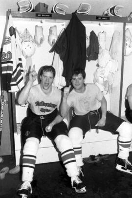 Two hockey players celebrate a win, St. Cloud State University