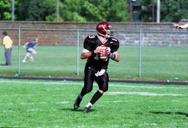 Keith Heckendorf plays quarterback during a football game against Augustana College, St. Cloud State University