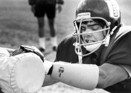 A football player at practice, St. Cloud State University