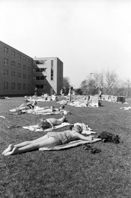 Sunbathers gather behind Mitchell Hall (1958), St. Cloud State University