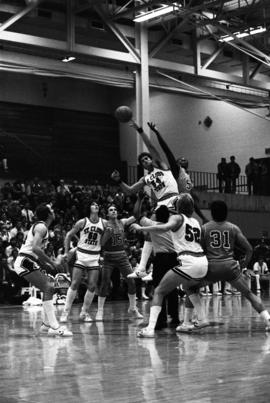 Dan Hagen jumps for a basketball in a game against St. John's University, St. Cloud State University