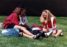 Three students talk together, St. Cloud State University