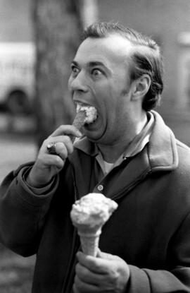 Man eats an ice cream cone, St. Cloud State University