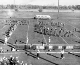 Marching band performs at Selke Field (1937), St. Cloud State University, 1950-1957