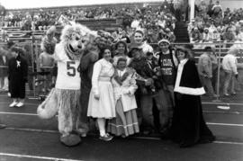 Homecoming royalty and others gather together at the homecoming football game, St. Cloud State University