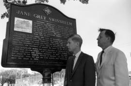 Richard Martin and Tom Meinz stand besides the Jane Grey Swisshelm historical marker, St. Cloud State University