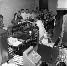 People are served food at Garvey Commons (1963), St. Cloud State University