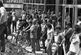 People listen to a speech, Day of Peace protest, St. Cloud State University