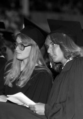 Susan Herriges and another woman at commencement, St. Cloud State University