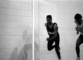 James White runs during a track meet, St. Cloud State University