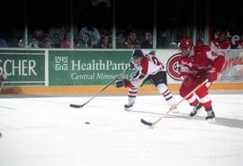 Action during a hockey game against the University of Wisconsin, St. Cloud State University