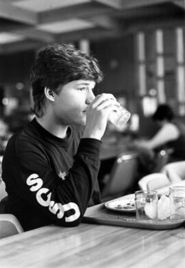 Man eats at Garvey Commons (1963), St. Cloud State University