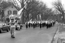 Marching band at the homecoming parade with Husky mascot, St. Cloud State University