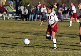 Kim Corbin kicks a soccer ball during a soccer game against Winona State University, St. Cloud State University