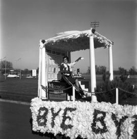 Homecoming queen Rebecca Planer sits on a parade float at the homecoming football game, St. Cloud State University