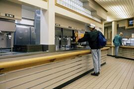 Men getting drinks, Garvey Commons (1963), St. Cloud State University