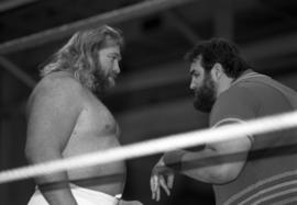 Big John Studd stares down his opponent Akeem in the wrestling ring at Halenbeck Hall, St. Cloud State University