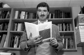 David Robinson looks at a book, St. Cloud State University